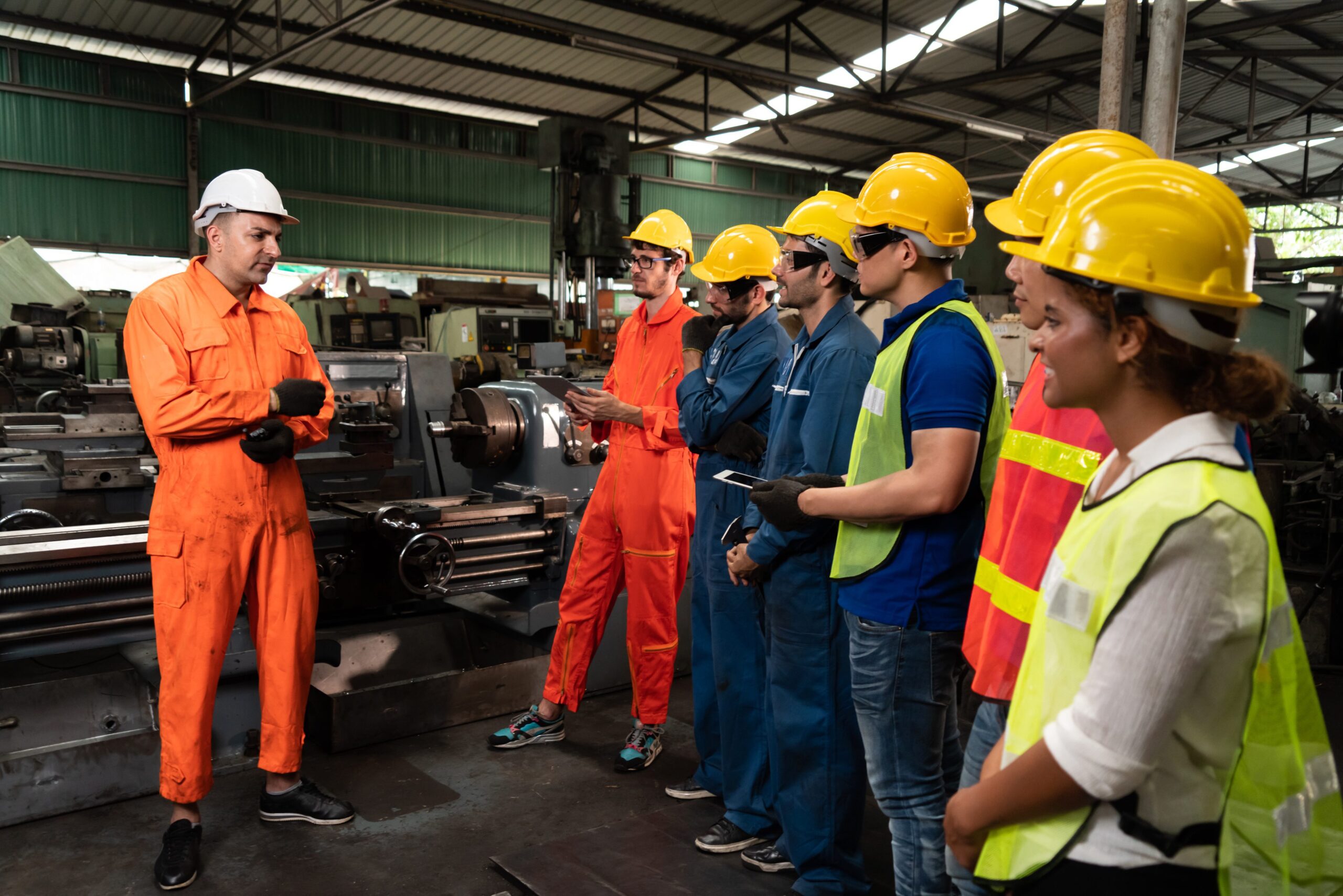Skillful,worker,attending,brief,meeting,in,the,factory,.,industrial