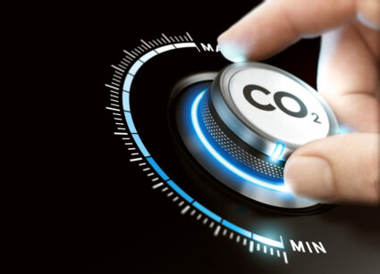 Man,turning,a,carbon,dioxide,knob,to,reduce,emissions.,co2